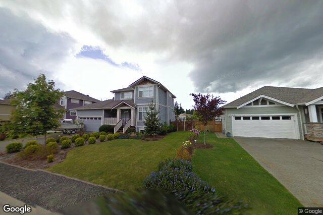 Street view of 2428 Sunriver Way, Sooke