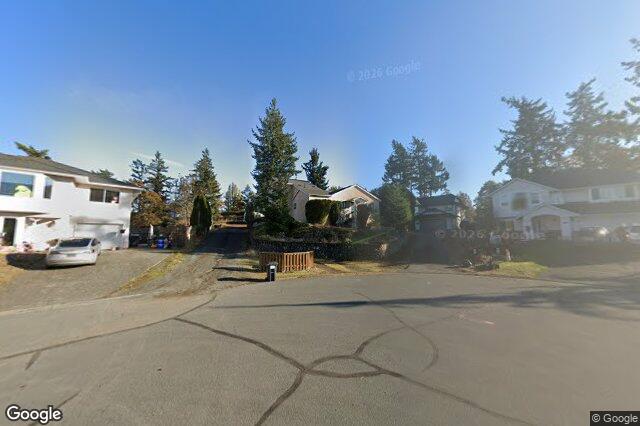 Street view of 668 Charmar Cres, Langford